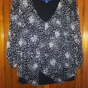 Sheer black and white blouse with black underlay